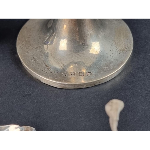 224 - A small group of silver, to include: a trumpet vase and a pair of salts. 116g.