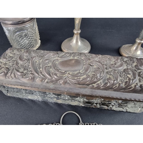 227 - A silver purse, by Turnbull Bros, Birmingham 1911, 12.5cm long; together with a pair of silver dwarf... 