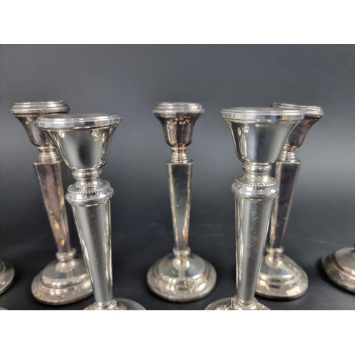 229 - A set of six silver candlesticks, by Sanders & Mackenzie, Birmingham 1970, 16cm high; together w... 