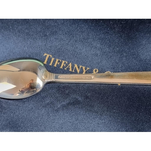 231 - Four white metal teaspoons, stamped 'Tiffany & Co Sterling', 83.3g.