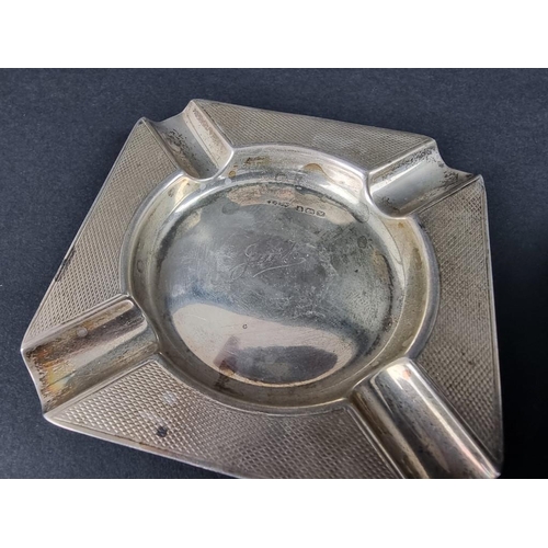 235 - Five various silver ashtrays; together with a small silver Armada dish, 261g.