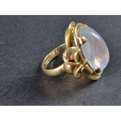 237 - A ring set large oval moonstone, stamped 14kt, size N.