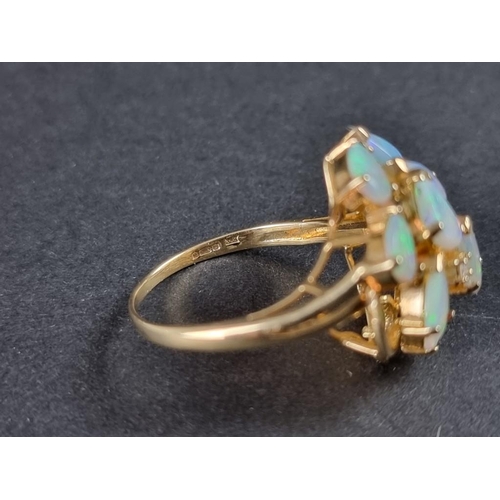 240 - A 9ct gold opal ring, set ten tear drop opals interspersed with four brilliant cut diamonds, size O ... 