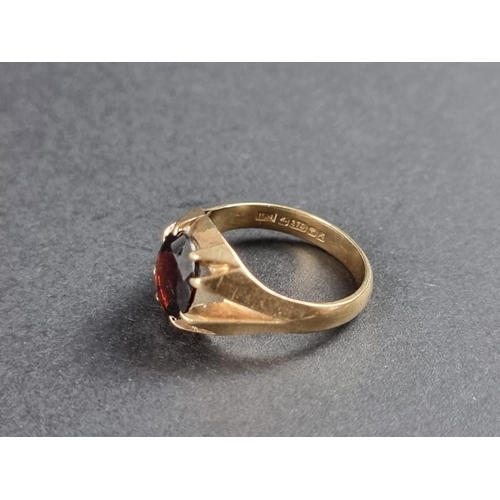 246 - A 9ct gold garnet signet ring, size S.