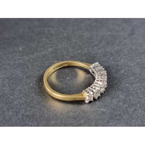 264 - An 18ct gold diamond seven stone half eternity ring, size M.