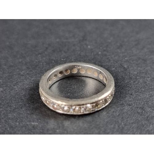 265 - A white metal diamond eternity ring, stamped 750, size M 1/2.