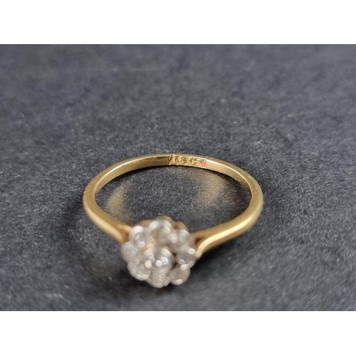 266 - A yellow metal diamond daisy ring, stamped 18ct, size N.