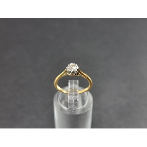 268 - An 18ct gold illusion set diamond solitaire ring, of approximately 0.125ct, size J.