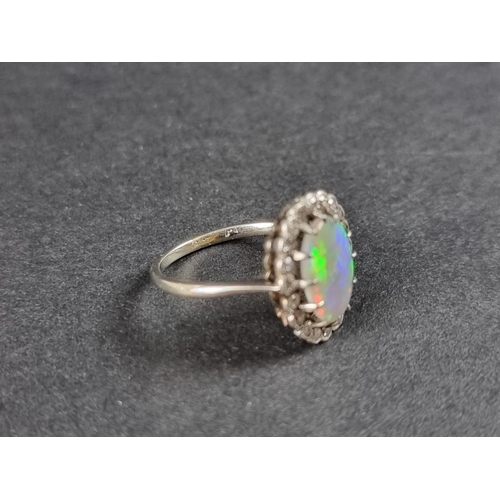 274 - A white metal opal and diamond cluster ring, stamped 18ct, size J.