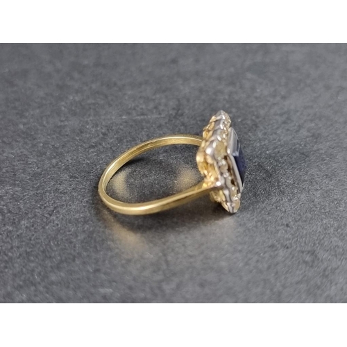 275 - An early 20th century yellow metal sapphire and diamond cluster ring, size N.