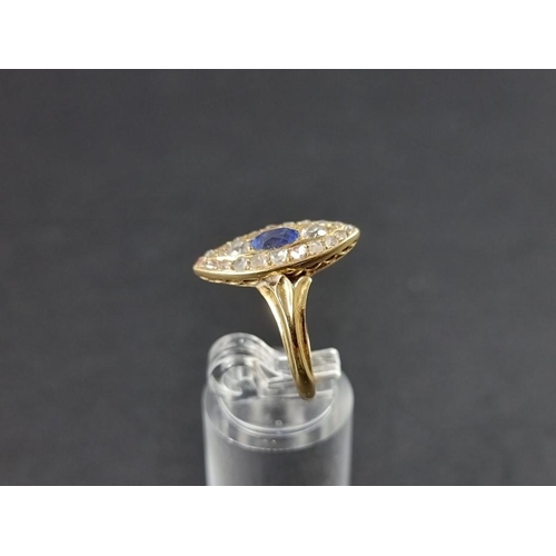 279 - An Edwardian marquise shaped diamond and sapphire cluster ring, set a central facetted sapphire surr... 