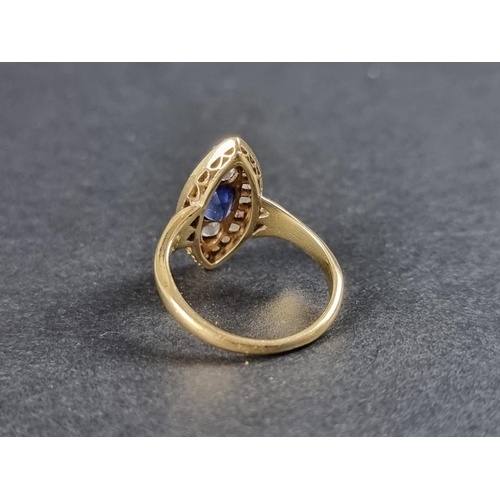 279 - An Edwardian marquise shaped diamond and sapphire cluster ring, set a central facetted sapphire surr... 