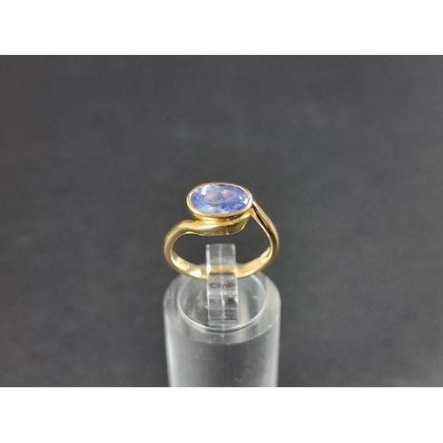 284 - An 18ct gold tanzanite ring, size k 1/2, gross weight 4.5g.