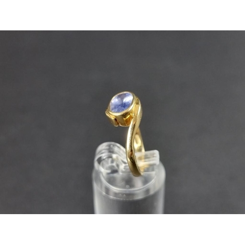 284 - An 18ct gold tanzanite ring, size k 1/2, gross weight 4.5g.