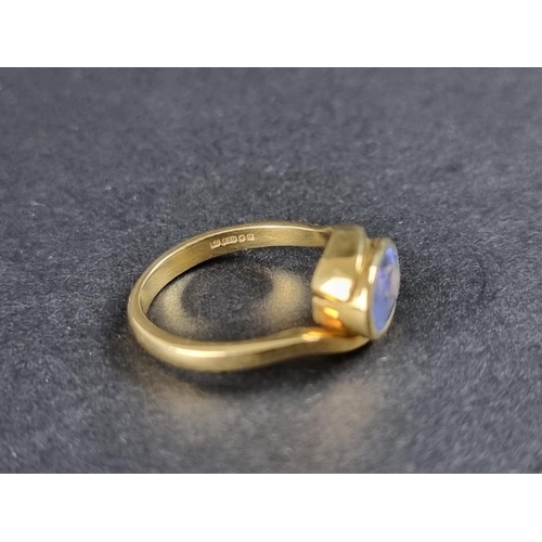 284 - An 18ct gold tanzanite ring, size k 1/2, gross weight 4.5g.