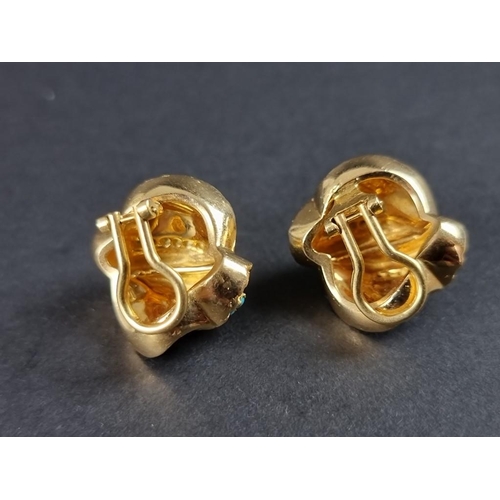 285 - A pair of gold and turquoise floral ear clips, stamped 750, 22mm.