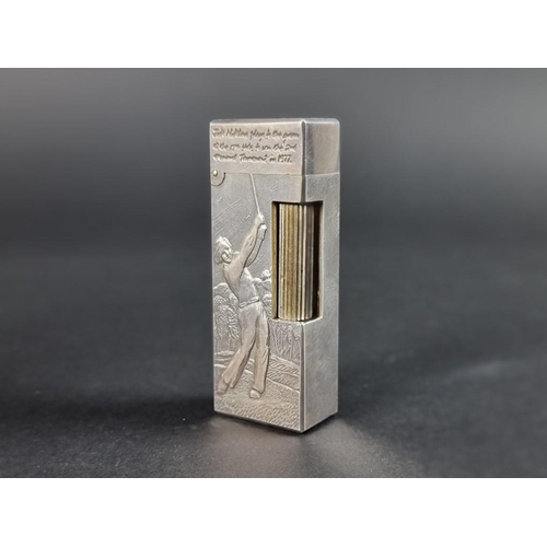 287 - Of Golfing Interest; a rare Alfred Dunhill limited edition silver cigarette lighter, designed by Cli... 