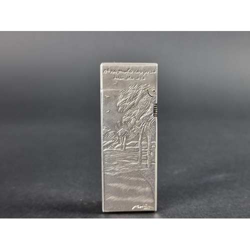 287 - Of Golfing Interest; a rare Alfred Dunhill limited edition silver cigarette lighter, designed by Cli... 