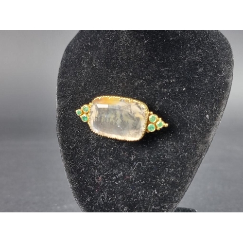 288 - An antique dendritic agate and emerald brooch, in a yellow metal mount, 44 x 19mm, cased.... 