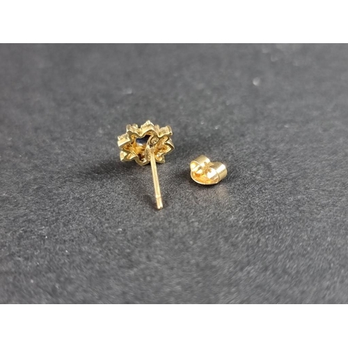 289 - A pair of yellow metal sapphire and diamond floral cluster ear studs, stamped '585'.... 