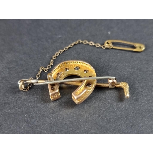 296 - A Victorian yellow metal diamond set horseshoe and riding crop brooch, stamped 15ct, 44mm, with atta... 