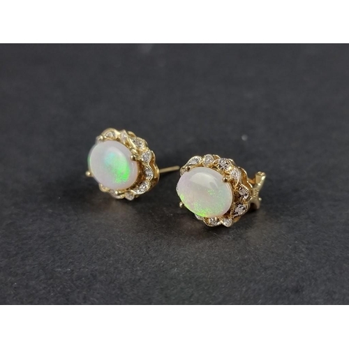 301 - A pair of opal and diamond ear studs, stamped 14k/585.