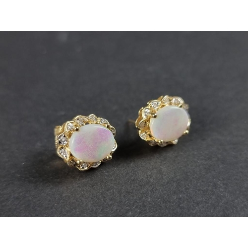 301 - A pair of opal and diamond ear studs, stamped 14k/585.