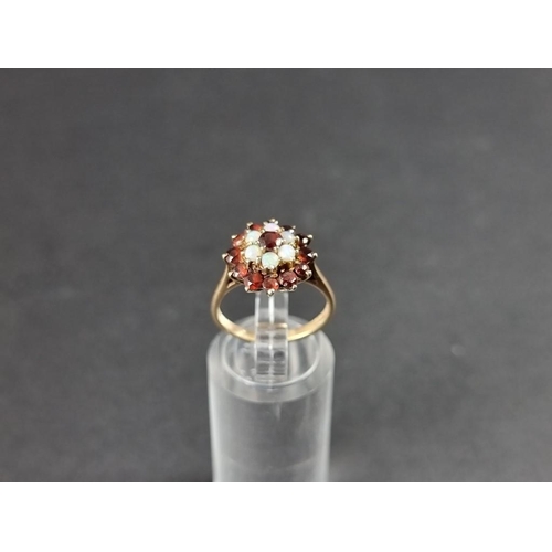 305 - A yellow metal garnet and opal cluster ring, stamped 9ct, size K.