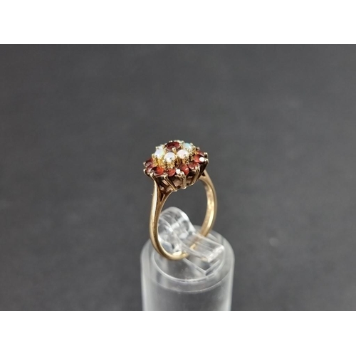 305 - A yellow metal garnet and opal cluster ring, stamped 9ct, size K.