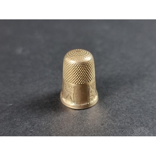 318 - A 19th century yellow metal thimble.