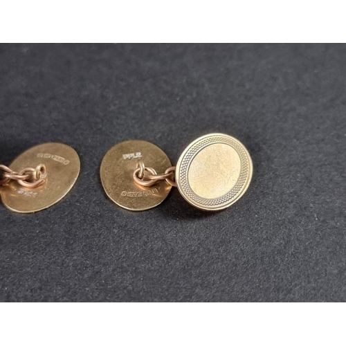 320A - WITHDRAWN FROM SALE A pair of 9ct gold cufflinks, with chain connectors, the heads 15 x 11mm, 3.6g; ... 