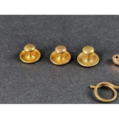 324 - A small quantity of yellow metal, comprising: a pair of 18ct gold dress studs, 1.3g; another dress s... 