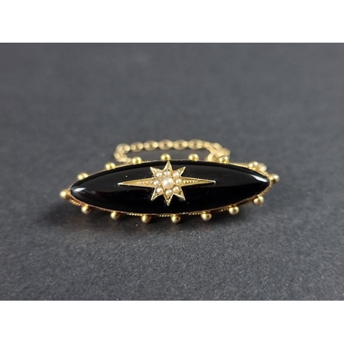 325 - A Victorian yellow metal black onyx and seed pearl memorial brooch, stamped 15ct, 15mm.... 