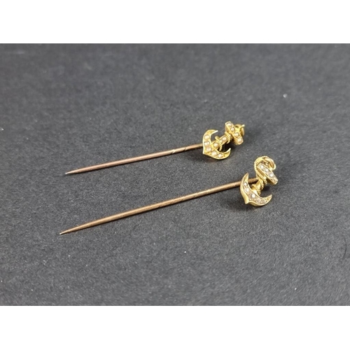 327 - A yellow metal stick pin, with diamond set anchor terminal, 57mm; together with another similar set ... 