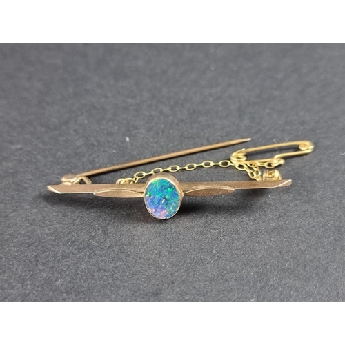 331 - A yellow metal and opal bar brooch, 50mm.