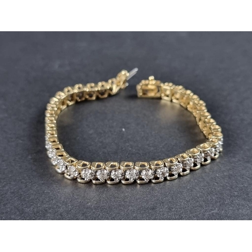 335 - A diamond Tennis bracelet, set forty brilliant cut diamonds totalling approximately 2ct, stamped '14... 