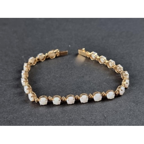 336 - A 9ct gold opal bracelet, 18cm.