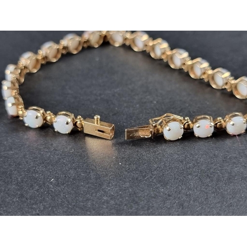 336 - A 9ct gold opal bracelet, 18cm.