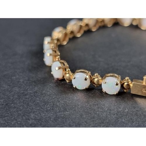 336 - A 9ct gold opal bracelet, 18cm.