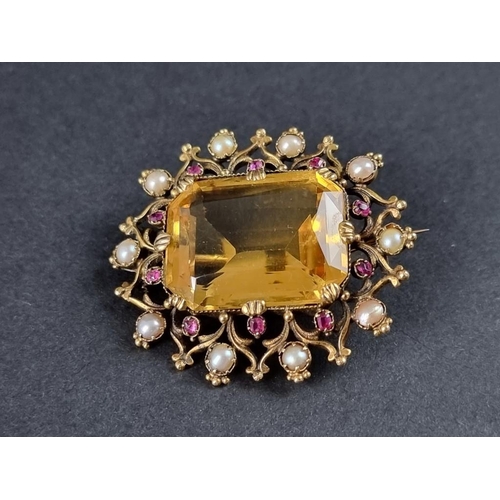 337 - A Victorian yellow metal brooch, set rectangular facetted citrine surrounded by ten rubies and ten s... 