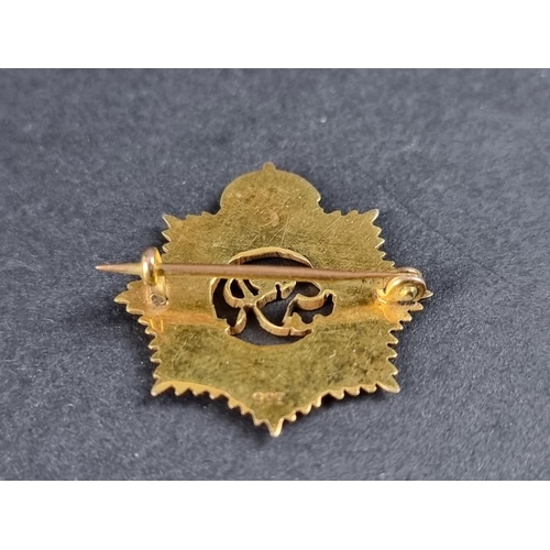 338 - A yellow metal and enamel George VI 'Royal Army Service Corps' badge, stamped '9ct', gross weight 3.... 