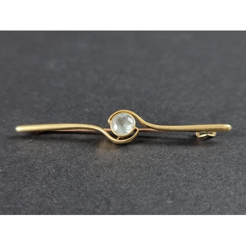 339 - A yellow metal and aquamarine bar brooch, stamped 15ct, 59mm.