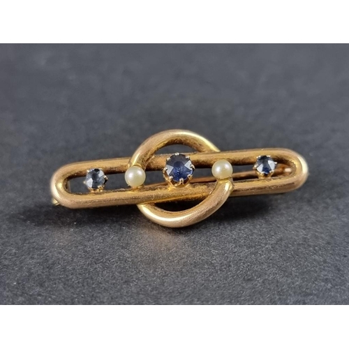 347 - A Victorian yellow metal brooch, set three sapphires and two pearls, 35mm.