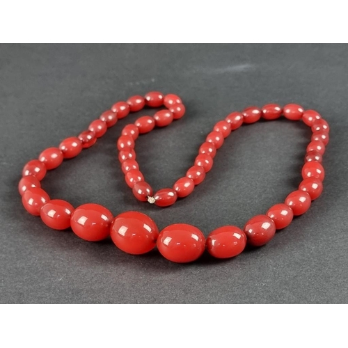 402 - A cherry amber graduated bead necklace, 79cm long, 72g.