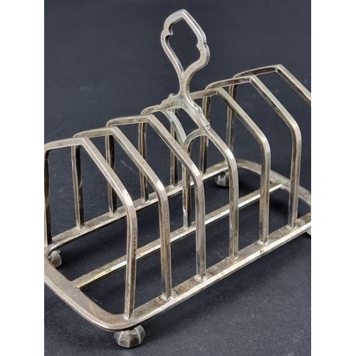 41 - A Victorian silver seven bar toast rack, by William Hutton & Sons, Sheffield 1889, 13.5cm, 213g.... 