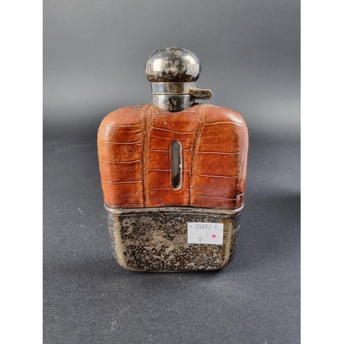 42 - A vintage 7oz glass hip flask, having EPNS mounts with crocodile skin cover.