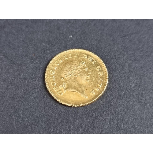 483 - Coins: a George III 1810 gold one third guinea.