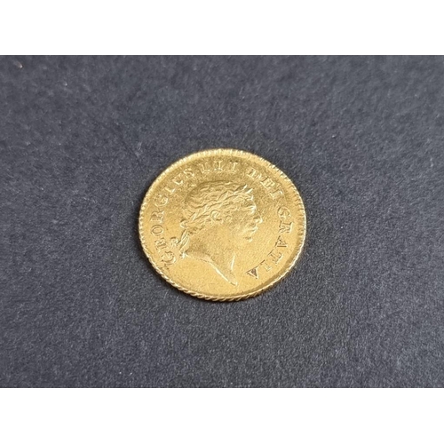 484 - Coins: a George III 1809 gold one third guinea.