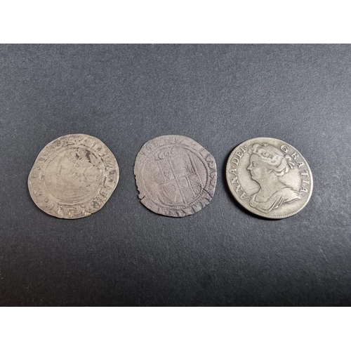 488 - Coins: a James I 1606 silver sixpence; together with an Elizabeth I silver shilling; and an Anne 170... 