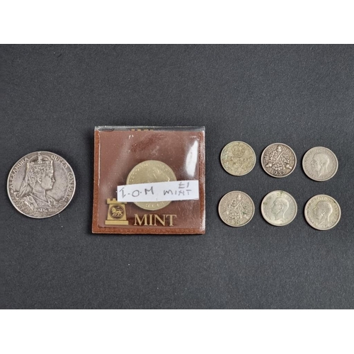 491 - Coins: an Isle of Man 1983 one pound coin; together with other silver coins and medals.... 